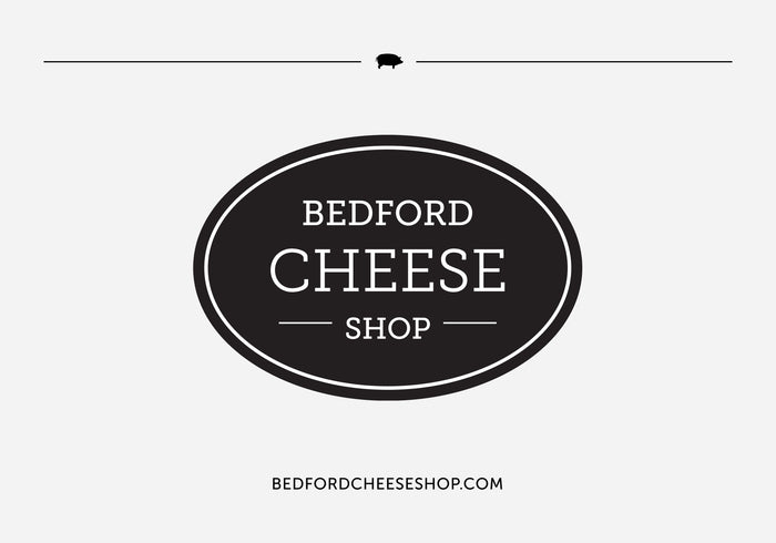 A screenshot of a Bedford Cheese Shop gift card with the Bedford Cheese Shop logo in the center, and the website address at the bottom.