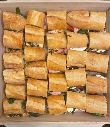 Image of the small sandwich platter. Please remember to indicate your sandwich choices in the notes section of your order (2 styles for small platters and 3 styles for large platters). Each sandwich is small/finger food sized. Small platter pricing is $108 and large platter pricing is $143 plus taxes and fees. 