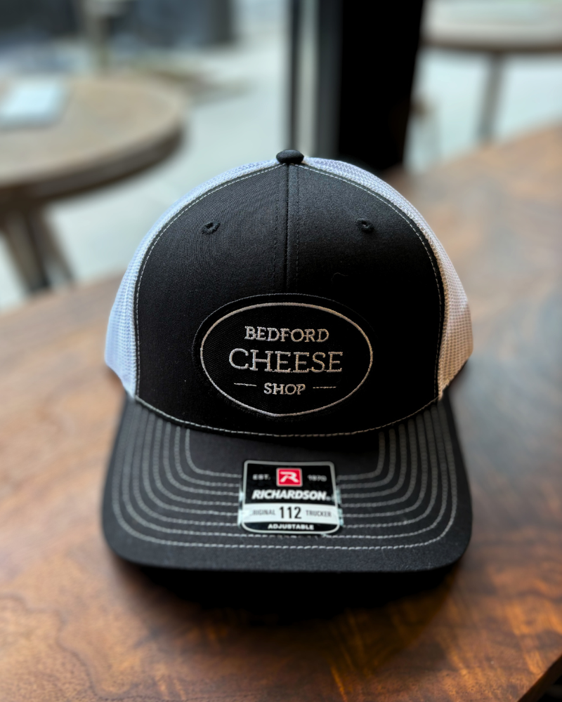 Image is of our one-size-fits-most trucker hat with our BCS Logo. 